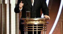Ricky Gervais delivered a shock two-word response to fans who are wanting him to host the 2026 Oscars; seen hosting the Golden Globes in 2020