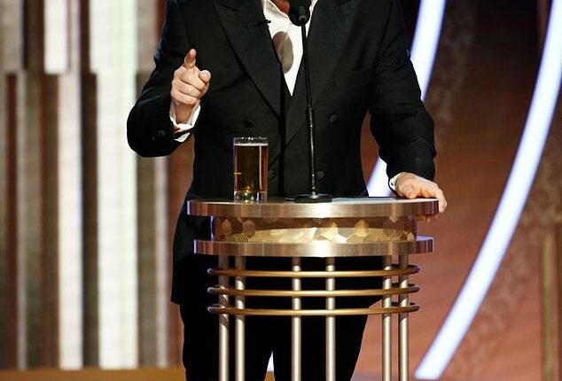 Ricky Gervais delivered a shock two-word response to fans who are wanting him to host the 2026 Oscars; seen hosting the Golden Globes in 2020