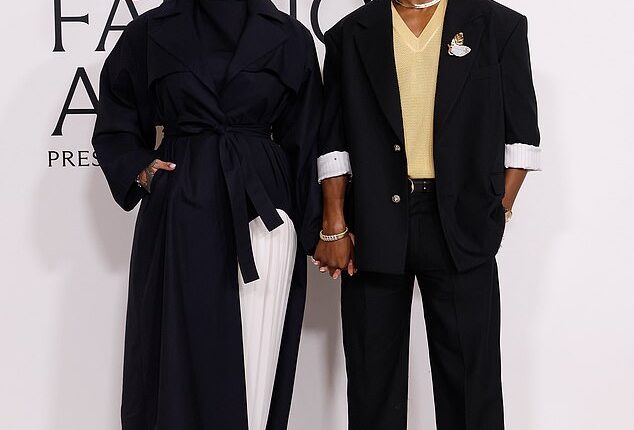 The woman accused of shooting at Rihanna's home while she and her family were inside was hit with multiple charges, including for attempted murder, on Tuesday; Rihanna and partner ASAP Rocky are pictured in November in NYC