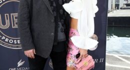 Kyle Sandilands might soon have a tidy sum in the bank after listing his Sydney property for sale. Pictured with wife Tegan Kynaston