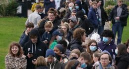Students queue at the University of Kent in Canterbury today amid the meningitis outbreak