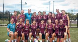 Iranian soccer players Fatemeh Pasandideh and Atefeh Ramezanisadeh (pictured centre of front row) have been welcomed with open arms by Brisbane's A-League Women's team