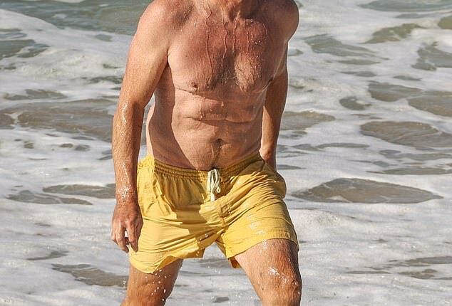 Simon Baker showed off his incredibly fit physique as he went for a swim at Bronte Beach on Wednesday