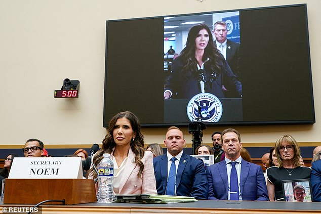 Noem¿s husband, Byron, could be seen sitting behind his wife with a deadpan expression as she faced continued grilling over her relationship with Lewandowski