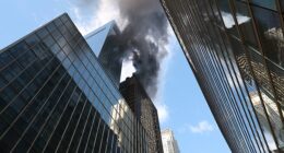 Firefighters are battling a blaze from a New York City skyscraper along the St. Patrick's Day Parade route less than an hour before the festivities are set to kick off