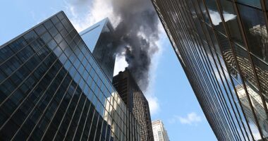 Firefighters are battling a blaze from a New York City skyscraper along the St. Patrick's Day Parade route less than an hour before the festivities are set to kick off