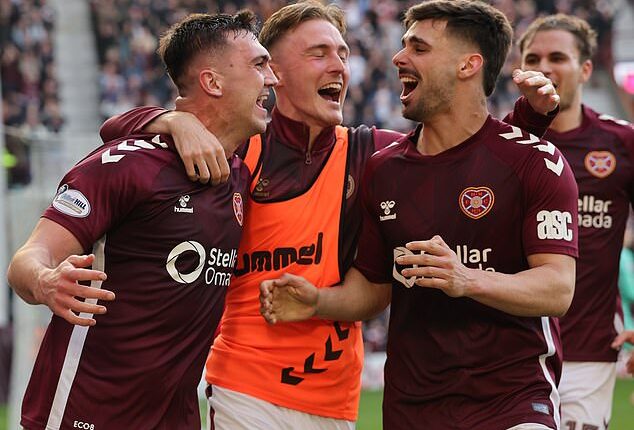 Oisin McEntee celebrates after scoring Hearts' winner against Dundee