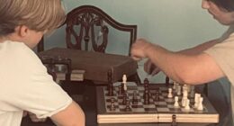 Angela Shellis was a doting mother who was happiest when she was at home with 'my boys' - her 18-year old son Tristan Roberts (right) and his brother Ethan, seen here playing chess