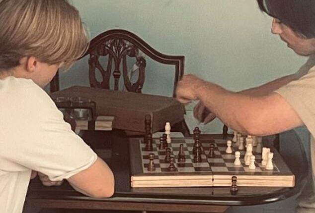 Angela Shellis was a doting mother who was happiest when she was at home with 'my boys' - her 18-year old son Tristan Roberts (right) and his brother Ethan, seen here playing chess