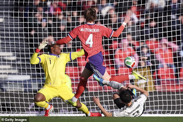 Scotland star Scott McTominay is denied by Japan goalkeeper Suzuki