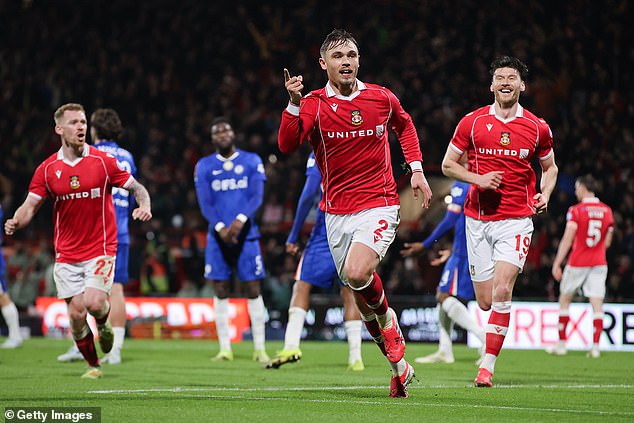Callum Doyle celebrates for Wrexham - who thrived playing at home against Chelsea