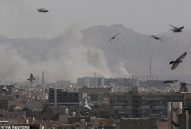 Smoke can be seen rising over Tehran, Iran Saturday morning after the US and Israel conducted 'major' operations after nuclear negotiations between the US and Iran broke down