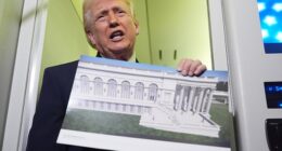 President Donald Trump holds up an image of his proposed ballroom during an Air Force One trip on Sunday