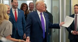 President Donald Trump greets patrons at The Varsity as Republican congressional candidate, Clay Fuller looks on, on February 19, 2026 in Rome, Georgia