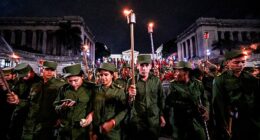 Two sources with an ear to Cuban leadership explain that Havana's top brass are reportedly 'shaking in their boots.' File image shows soldiers marching by torchlight in Havana in January