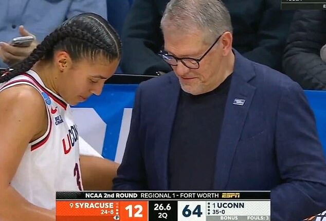 Azzi Fudd (L) followed advice from coach Geno Auriemma (R) and trimmed her fingernails