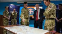 Defence Secretary John Healey is given a briefing as he meets military personnel during a visit to the Permanent Joint Headquarters in Northwood, North West London, today