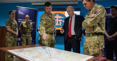 Defence Secretary John Healey is given a briefing as he meets military personnel during a visit to the Permanent Joint Headquarters in Northwood, North West London, today