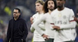 Liam Rosenior is pictured on the pitch while his players look dejected as they applaud their fans
