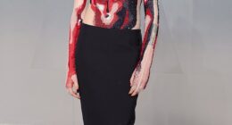 English model Cara Delevingne, 33, arrived in a long-sleeve bodysuit that was adorned with red, black and white sequins to resemble a male torso. She finished the look with a black pencil skirt and wore her hair in a slick updo