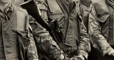 Patrick Mercer, 69, (pictured centre, holding a rifle) completed nine tours of Northern Ireland