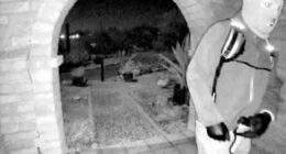 Picture provided by the FBI shows a masked man at the home of Nancy Guthrie the night she went missing in Tucson, Ariz