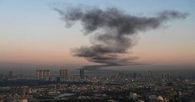 Smoke rises near Erbil International Airport, Iraq, which hosts US-led coalition troops, on Sunday