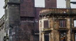 Workers were lifted more than 150ft into the air as they began demolition works