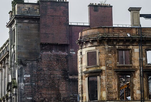 Workers were lifted more than 150ft into the air as they began demolition works