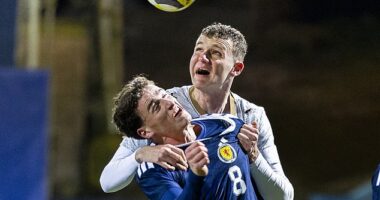 Barney Stewart is beaten to the ball by young Czech powerhouse Ondrej Coudek