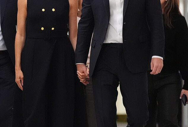 Meghan wearing a black Karen Gee dress during a visit to the Royal Children's Hospital in Melbourne