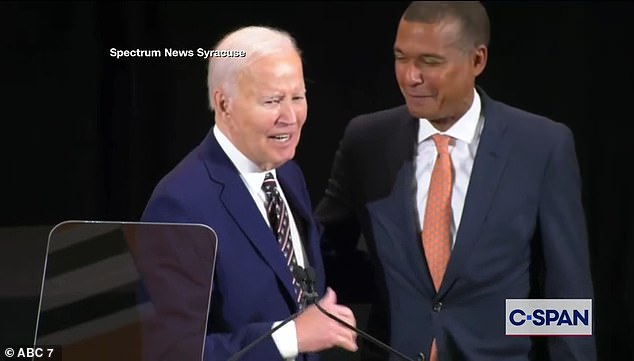 Former President Joe Biden (left) called Jeff Scruggs (right), the chairman of Syracuse University's Board of Trustees to his side on Tuesday during a portrait unveiling ceremony to tell him he looked like 'Barack'