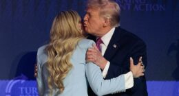 President Donald Trump (right) gives Erika Kirk (left) a hug and a kiss as he arrives Friday at Dream City Church in Phoenix, Arizona, for a Turning Point USA 'Build the Red Wall' event
