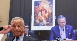 UHealth and Human Services (HHS) Secretary Robert F. Kennedy Jr. listens as Rep. Mark Takano (D-CA) presents an AI image posted by U.S. President Donald Trump depicting himself as a Jesus-like figure, which President Trump said was showing him as a medical professional
