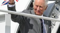 Charles waves goodbye as he boards his plane at Joint Base Andrews in Maryland
