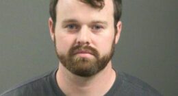 Joseph Duggar was arrested on Wednesday in connection with allegations that he touched a nine-year-old girl on her underwear and genitals; he's pictured in his mugshot after the arrest
