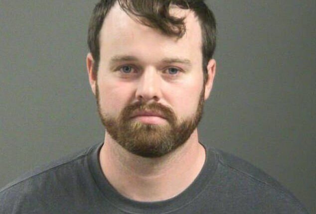 Joseph Duggar was arrested on Wednesday in connection with allegations that he touched a nine-year-old girl on her underwear and genitals; he's pictured in his mugshot after the arrest