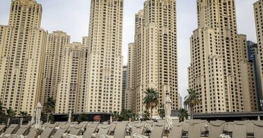 Empty sun loungers line a beach at Jumeirah Beach Residence, formerly a tourism hotspot