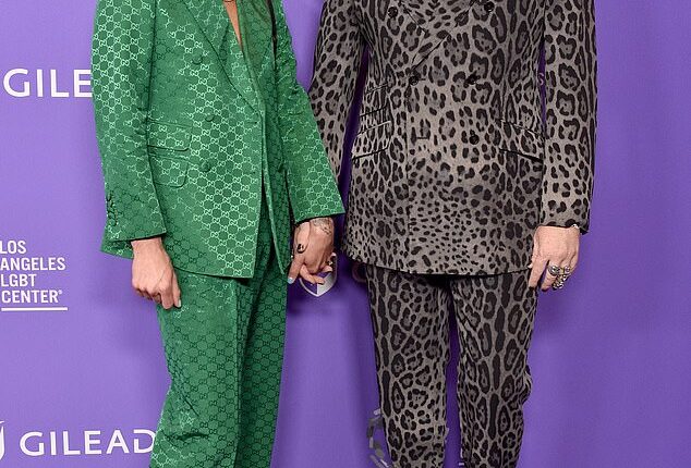 Adam Lambert (R, pictured in 2023) has reportedly amicably ended his relationship with boyfriend Oliver Gliese (L) after four years of dating