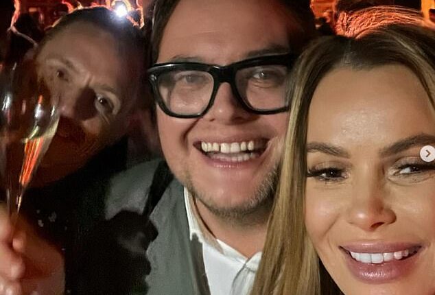 Amanda Holden rung in the New Year in style on Sunday as she joined her best pal Alan Carr for a wild party at Estelle Manor