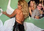 Amanda Holden sizzles in a daring backless gown as she guzzles champagne on a boozy night out with Alan Carr at BAFTA TV bash