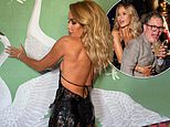 Amanda Holden sizzles in a daring backless gown as she guzzles champagne on a boozy night out with Alan Carr at BAFTA TV bash