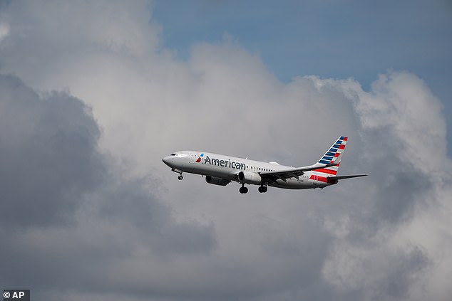 An American Airlines flight has been diverted to Tucson, Arizona after a fire broke out board a plane, according to local news outlets. (Pictured: An American Airlines plane in flight)