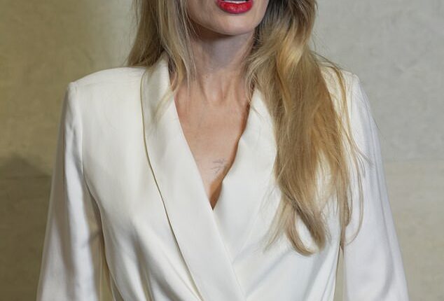 Angelina Jolie sparked a wild fan frenzy that she had been replaced by a body double after making an 'unrecognizable' appearance at Shanghai Fashion Week