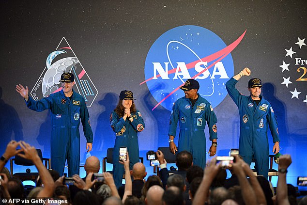 The crew of Artemis II received a standing ovation on Saturday as they returned to NASA's Johnson Space Center in Houston, Texas