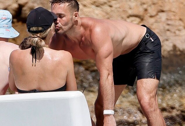 Vogue Williams and Spencer Matthews appeared more loved-up than ever as they packed on the PDA amid their lavish family getaway to St Barts on Friday