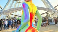 American YouTuber and make-up artist James Charles was a repeat fashion offender after also making the cut for worst dressed on weekend one. This time around, he wore a garish rainbow-colored bodysuit before playfully pulling down his neon blue pants to flash his derriere
