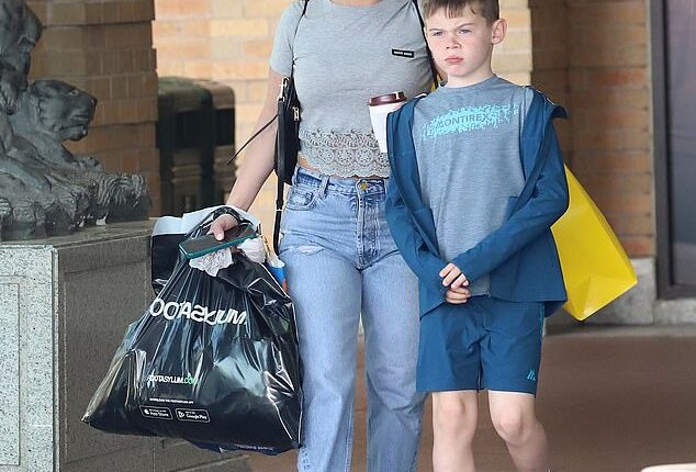 Coleen Rooney enjoyed a lavish shopping trip at Selfridges at Manchester's Trafford Centre with her son Klay on Friday