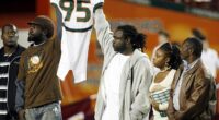 Bryan Pata's family holds up his jersey at the beginning of a college football game back in 2006