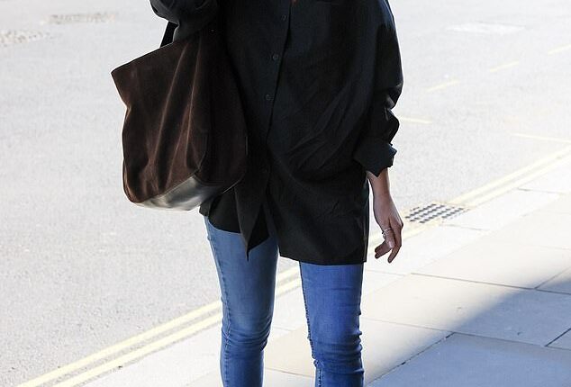 Emily Atack showed off her slimmer physique as she greeted onlookers during an appearance in London on Friday